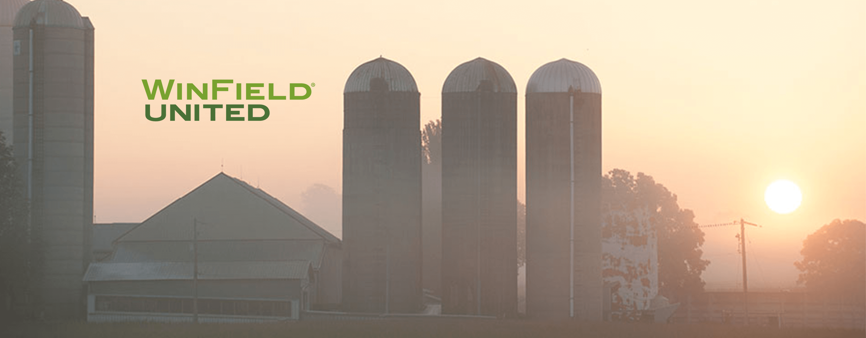 WinField United Logo Over A Farm At Sunrise