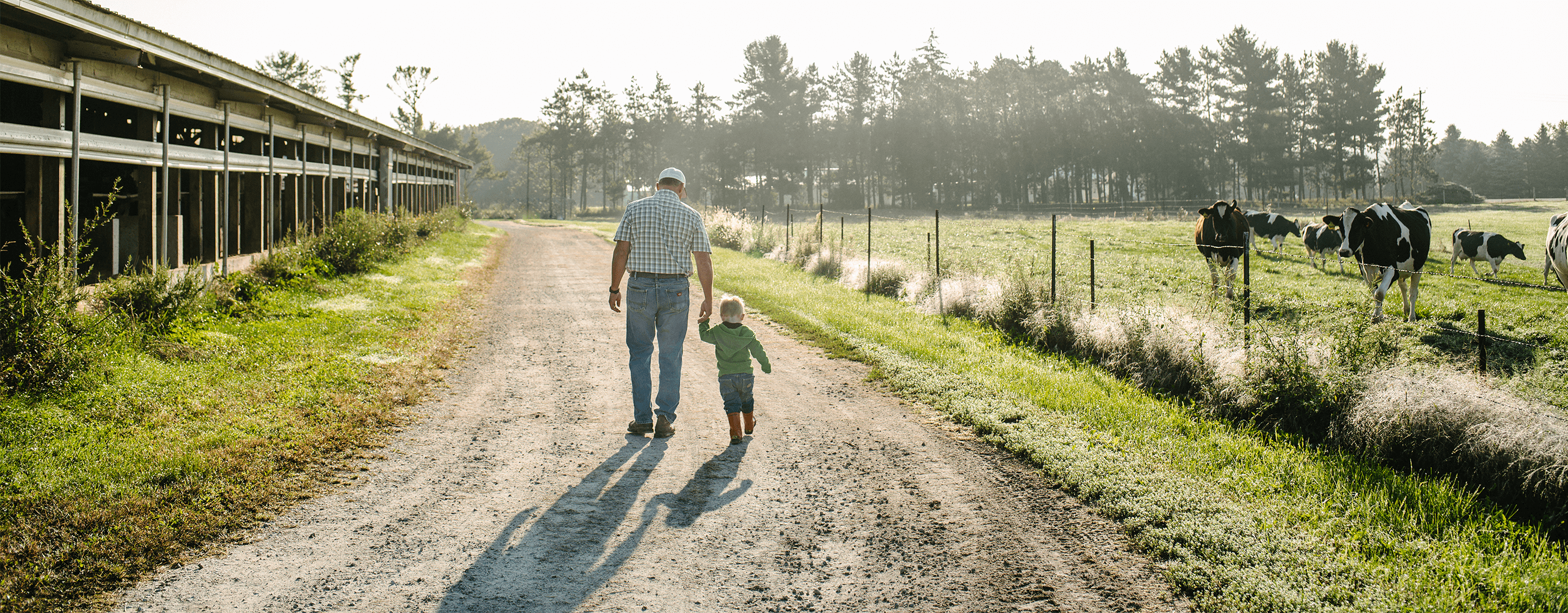 Pete Kappelman Walking On His Farm With His Grandson