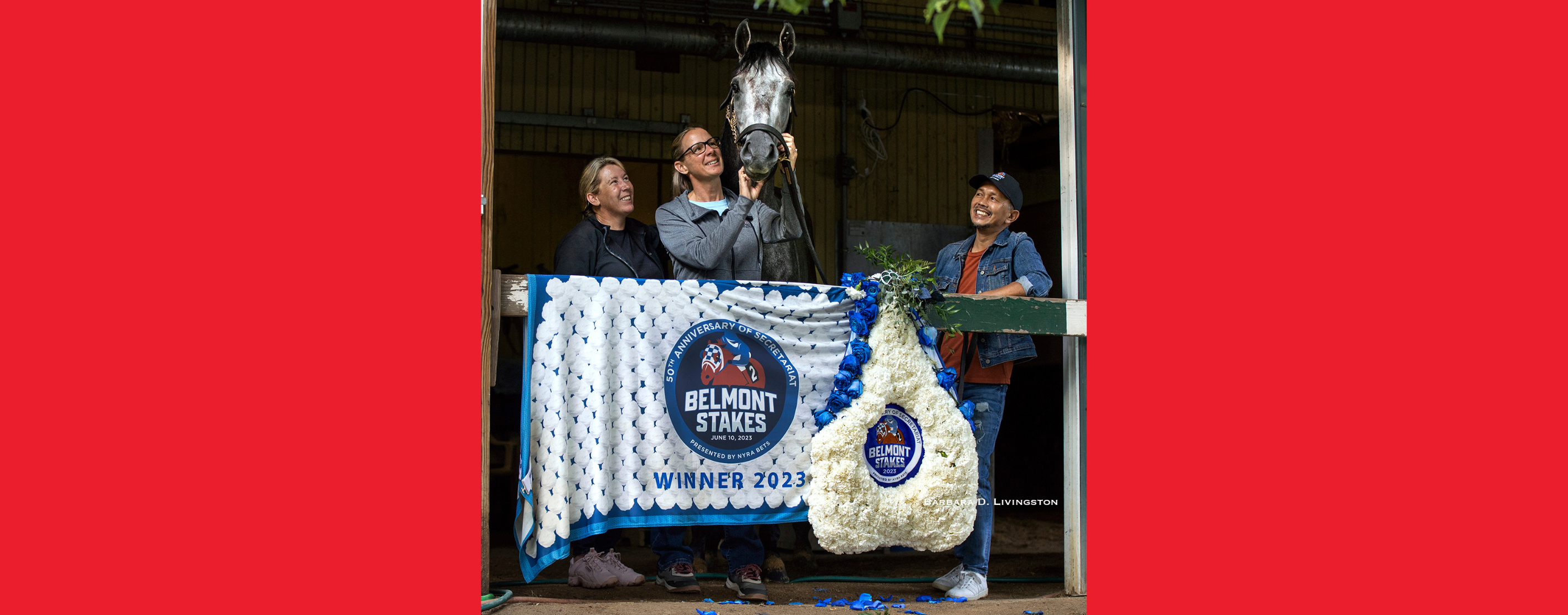 Horse Jena Antonucci stands behind a winner's banner with her horse, Arcangelo