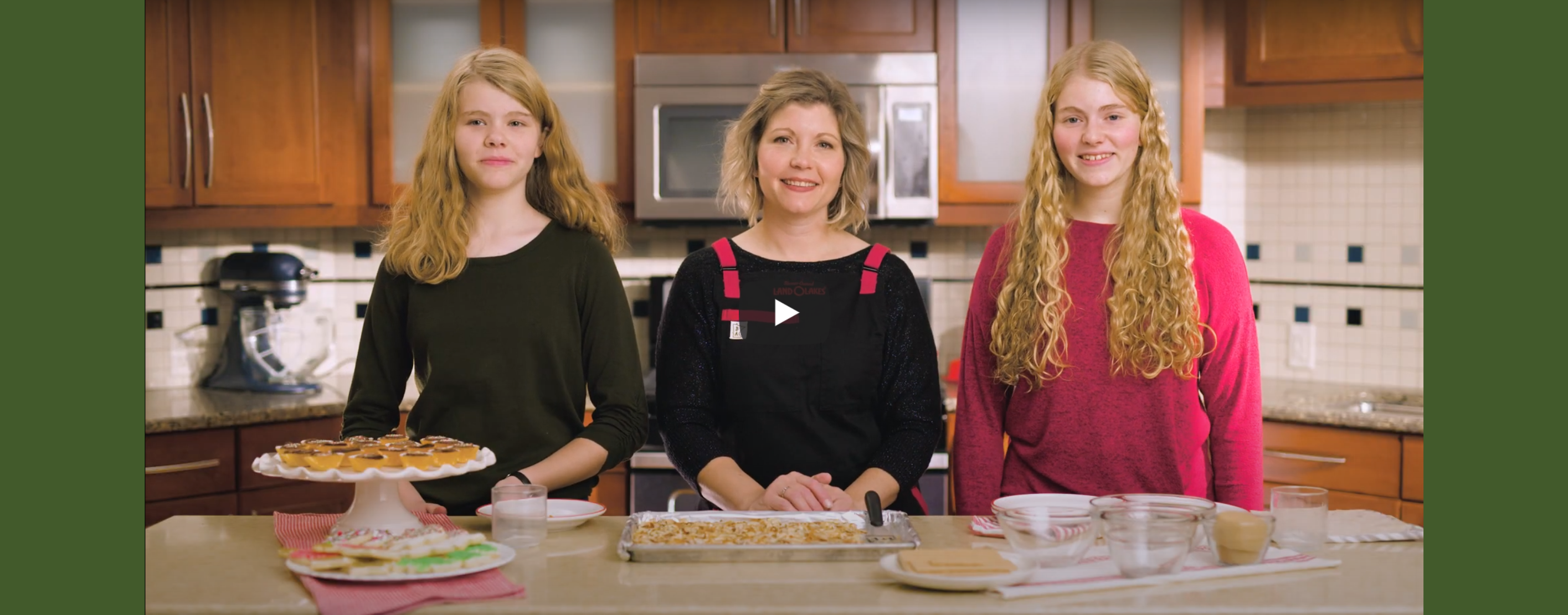 Sadie Frericks and her two daughters in a kitchen
