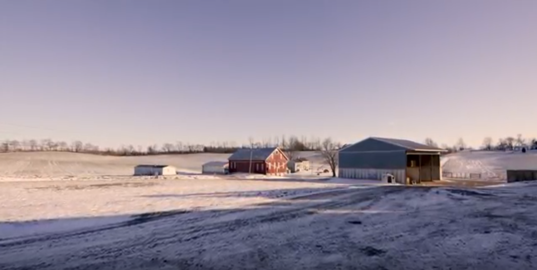 An Aerial View Of A Farm In Winter