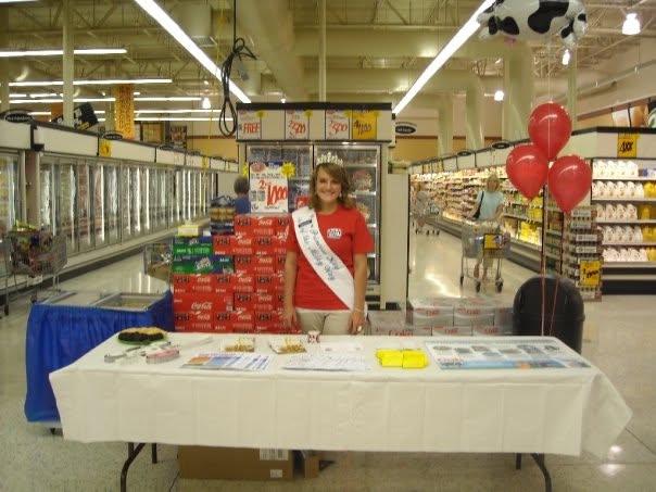 Princess Kay of the Milky Way promotes dairy at a community grocery store event.