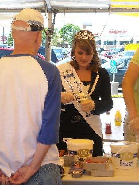 Princess Kay of the Milky Way hands out ice cream cones.