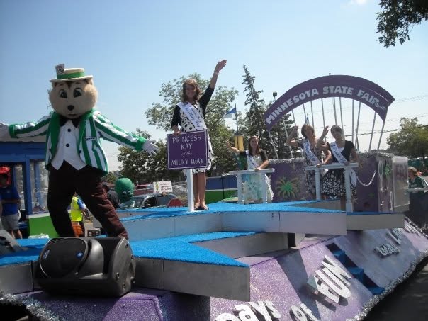 Princess Kay of the Milky Way waves from a Minnesota State Fair parade float.