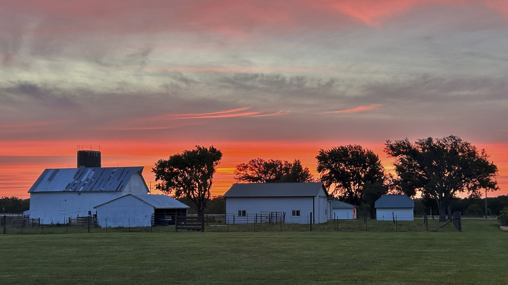 A farm at sunset